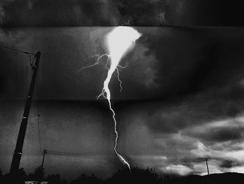 Low angle view of light painting against sky