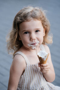 Close-up of young woman holding ice cream