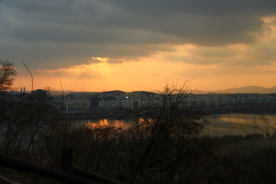 Scenic view of lake against sky during sunset