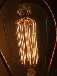 Close-up of illuminated light bulb