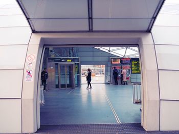 People at railroad station seen from entrance