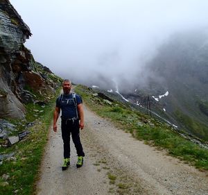 Full length of man standing on mountain