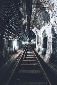 Railroad tracks in tunnel