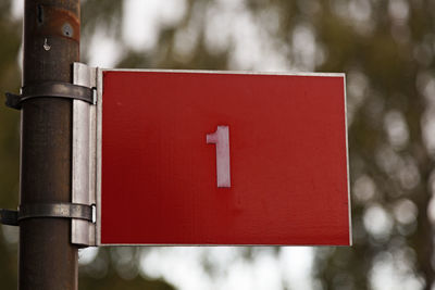 The number one on a red sign with white text