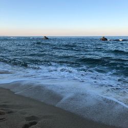 Scenic view of sea against clear sky