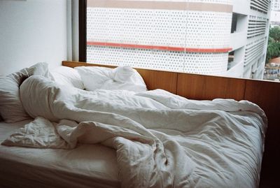 Close-up of blanket on bed at home