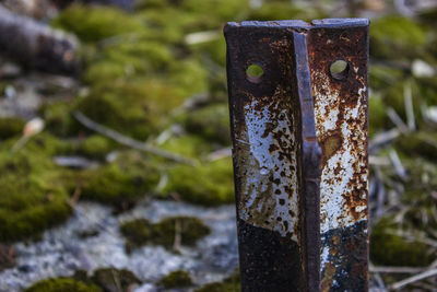 Close-up of old wooden post