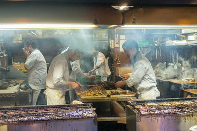 Group of people at market stall