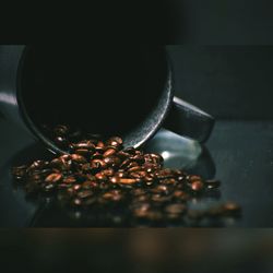 Close-up of coffee beans on table