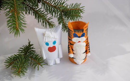 Diy a tiger and a bull from a toilet paper sleeve for the chinese new year 2022. place for your text
