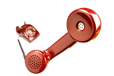 Close-up of telephone over white background