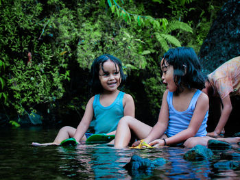 Woman and girl enjoying in water