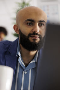 Portrait of businessman using mobile phone