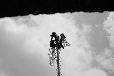 Low angle view of crane against sky