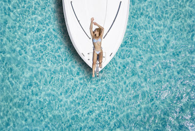 High angle view of ship floating in swimming pool