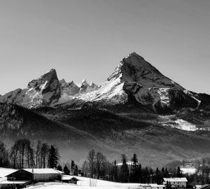 Scenic view of snowcapped mountains against clear sky