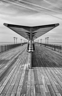 Pier over sea against sky