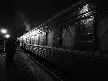 Train at railroad station at night