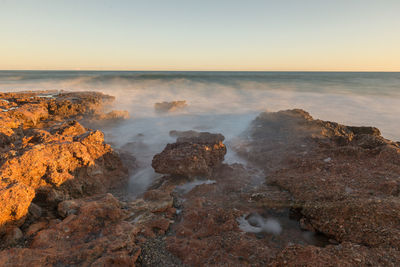 Scenic view of sea against clear sky