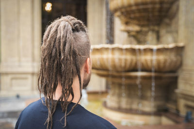 Rear view of man with braided hair