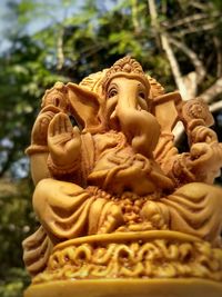 Close-up of statue against temple