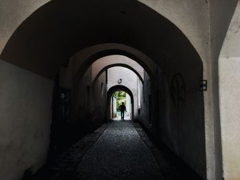 Rear view of people walking in corridor