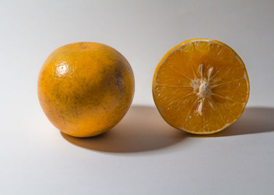 Close-up of orange on white background