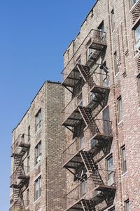 Low angle view of building against clear blue sky