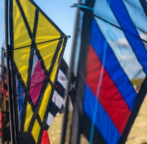 Close-up of flags against blue sky