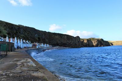 Scenic view of sea against blue sky