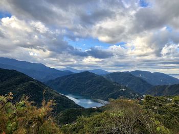 Scenic view of landscape and mountains against sky