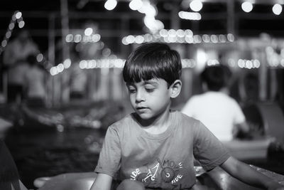 Portrait of boy looking away outdoors