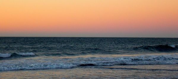 Scenic view of sea at sunset