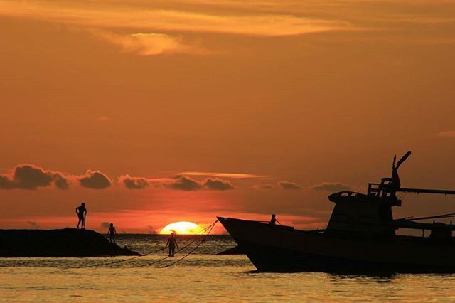 sunset, sea, silhouette, orange color, water, nautical vessel, sky, transportation, scenics, boat, mode of transport, beauty in nature, sun, tranquil scene, tranquility, nature, horizon over water, cloud - sky, idyllic, waterfront