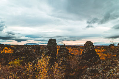 Rock formations on landscape against sky