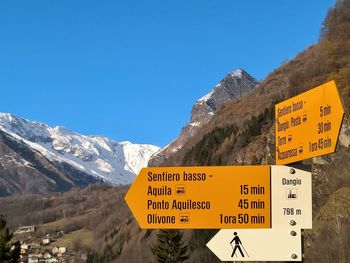 Information sign against mountains