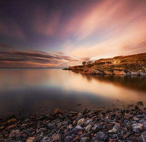 Scenic view of sea against sky at sunset