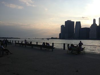 People in water at sunset