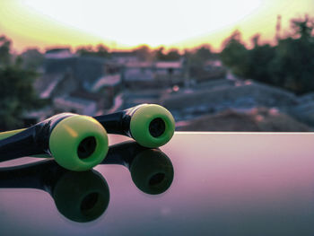 Close-up of toy against sky during sunset