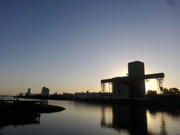 Silhouette of buildings at waterfront