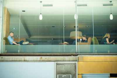 Reflection of people on glass window