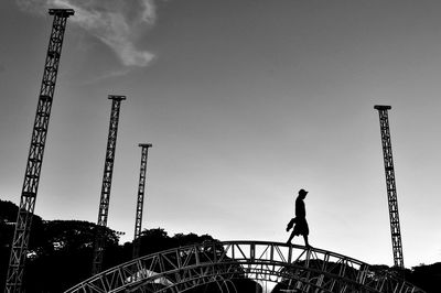 Low angle view of crane against sky