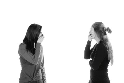 Full length of woman against white background