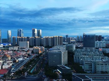 High angle view of buildings in city against sky