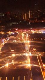 Aerial view of illuminated city at night