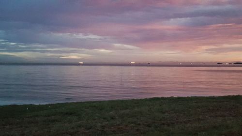 Scenic view of sea against sky at sunset