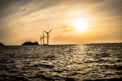 Scenic view of sea against sky during sunset