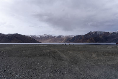 Scenic view of landscape and mountains against sky