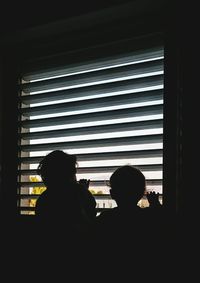 Silhouette of woman in dark background