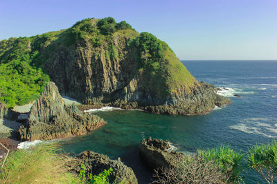 Scenic view of calm sea against blue sky